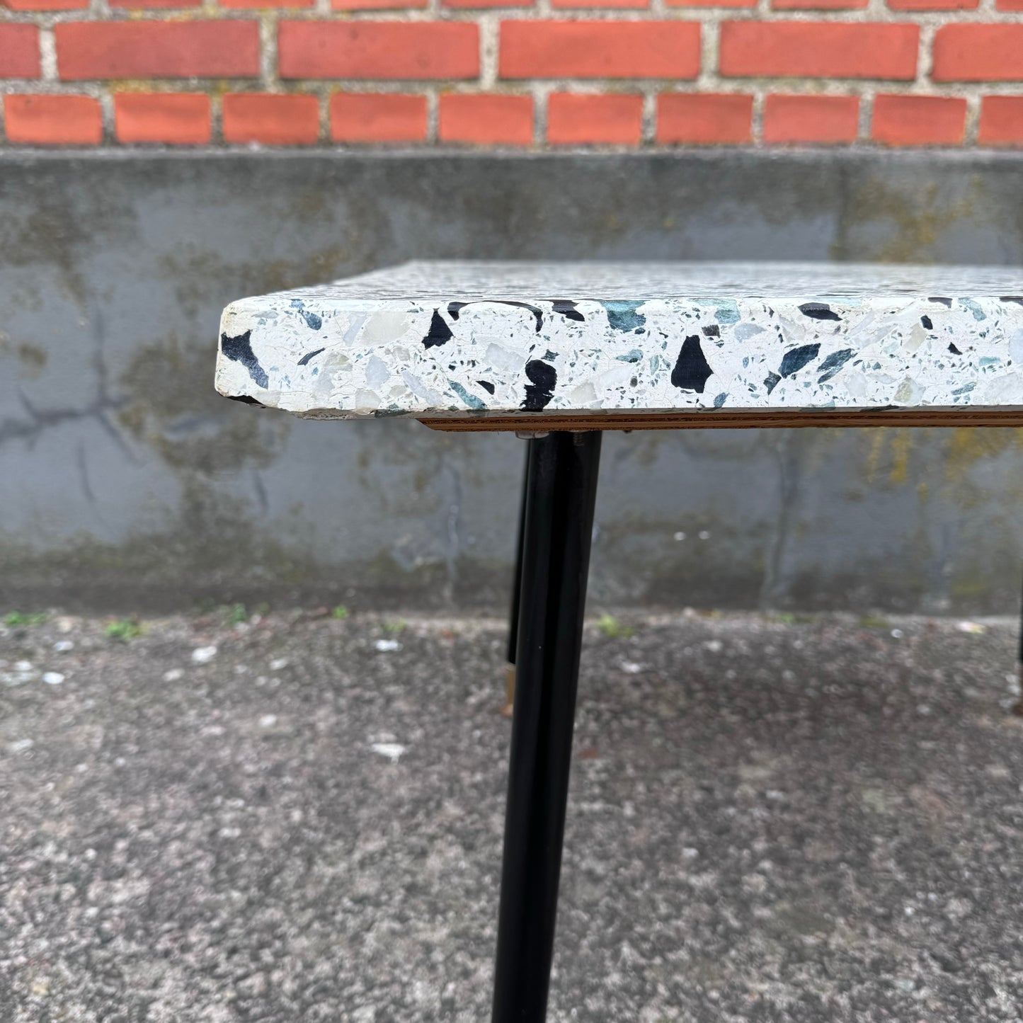 Coffee table in terrazzo with brass details