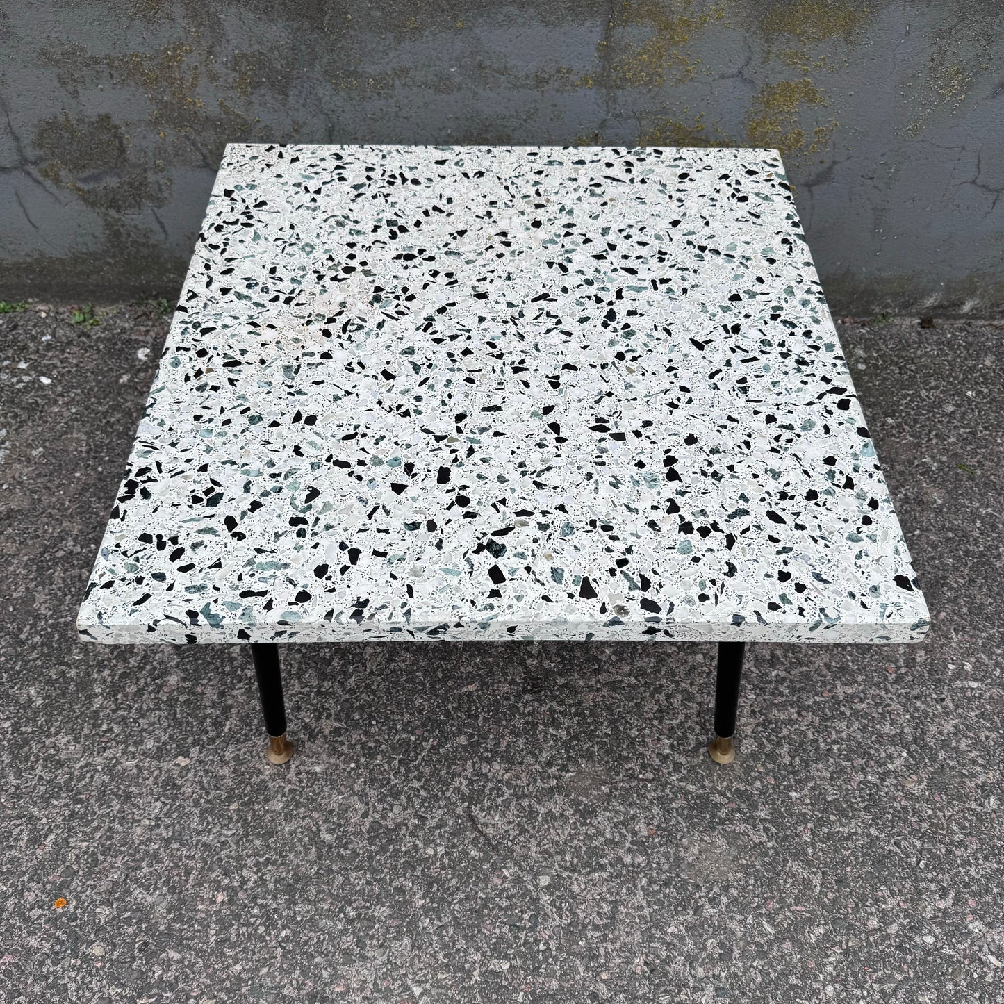 Coffee table in terrazzo with brass details