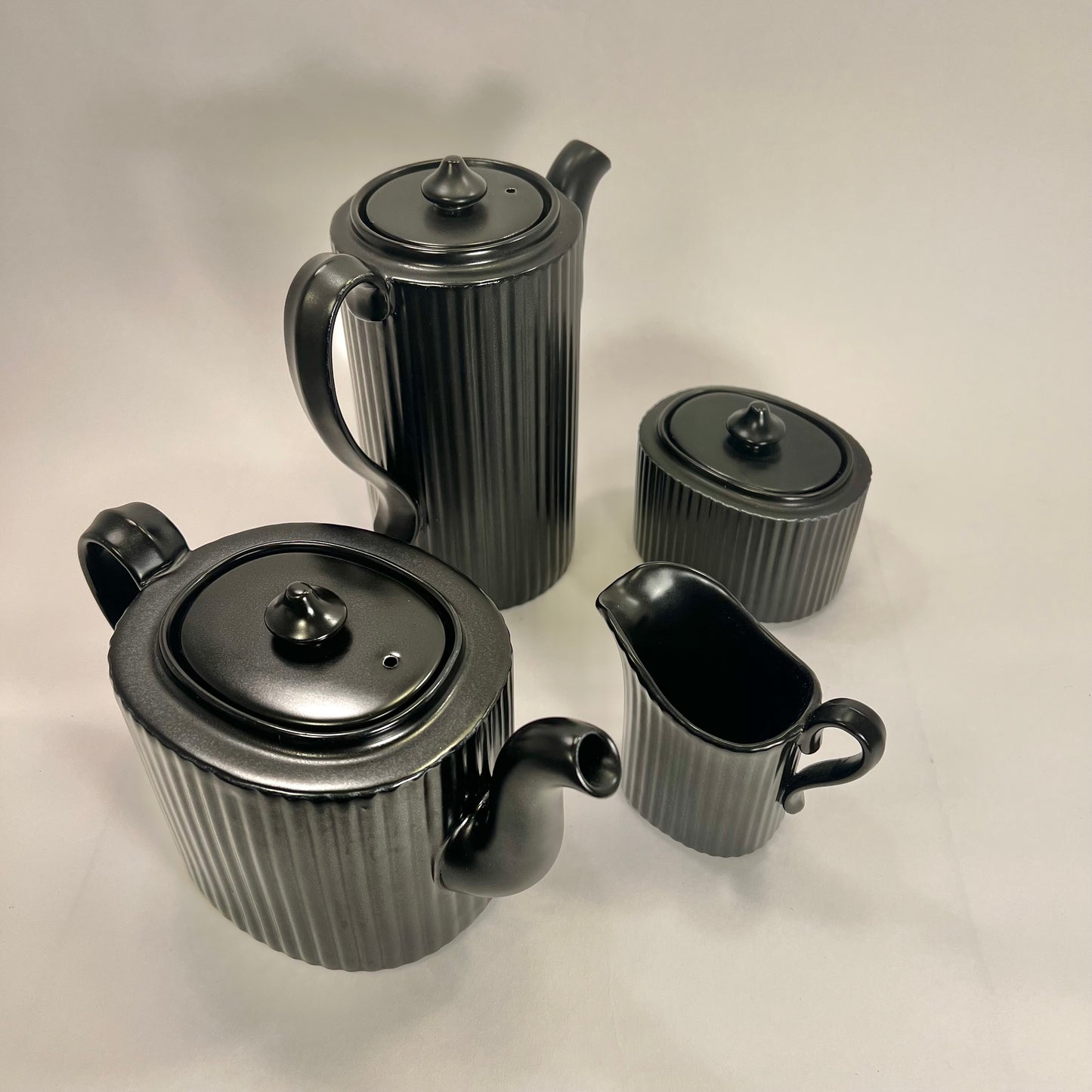Tea and coffee pottles by Arthy Percy