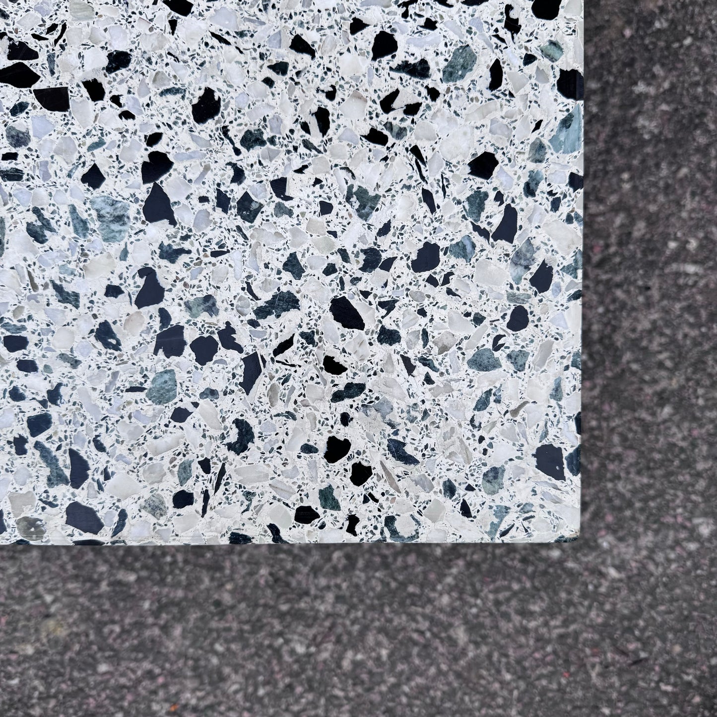 Coffee table in terrazzo with brass details